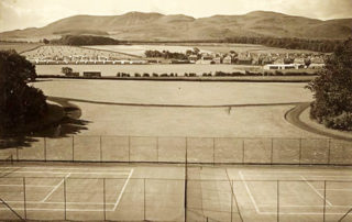 Image shows an old photo taken during the 1950's from the old City Hospital in Greenbank, Edinburgh and shows the tennis courts in the foreground, with the Pentland Hills and Swanston Farm in the background.